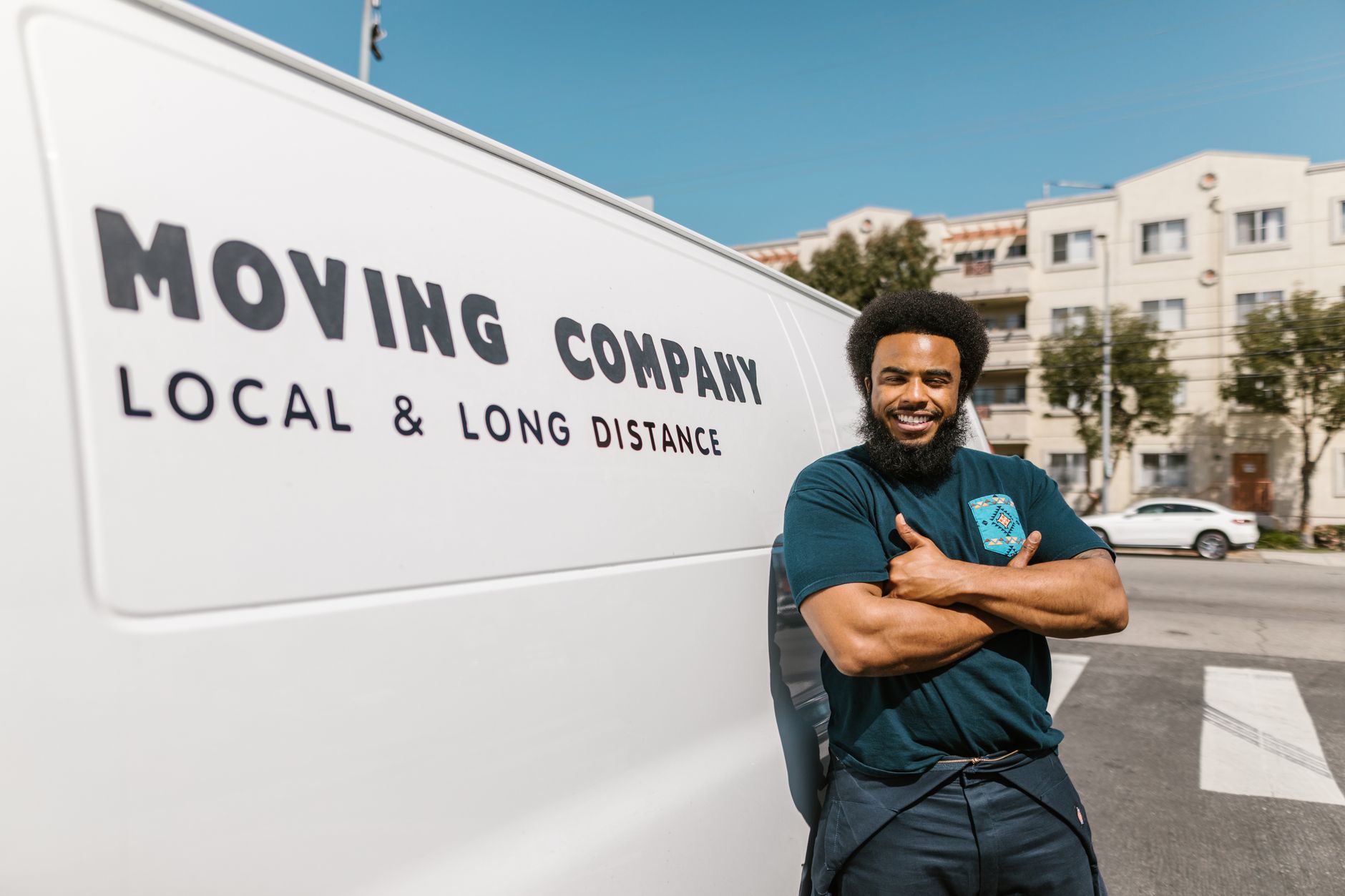 Affordable movers loading boxes into a moving truck for a local move.