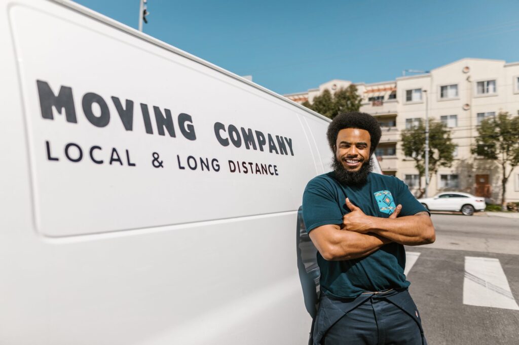 moving company - Affordable movers loading boxes into a moving truck for a local move.